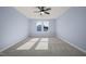 Bright bedroom with grey carpet and ceiling fan at 2804 Jack Mitchell Rd, Zebulon, NC 27597