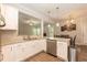 Modern kitchen featuring white cabinets, granite countertops, and stainless steel appliances at 159 Shady Oaks Dr, Benson, NC 27504