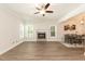 Living room features a stone fireplace and hardwood floors at 159 Shady Oaks Dr, Benson, NC 27504