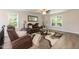 Upstairs sitting area with two brown leather recliners and a glass coffee table at 159 Shady Oaks Dr, Benson, NC 27504
