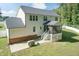 Two-story house with screened porch, patio, and fenced backyard at 159 Shady Oaks Dr, Benson, NC 27504