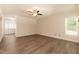 Spacious living room with hardwood floors and a view into the dining area at 159 Shady Oaks Dr, Benson, NC 27504