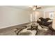 Upstairs sitting area with brown leather reclining furniture and area rug at 159 Shady Oaks Dr, Benson, NC 27504