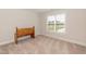 Simple bedroom with wood bench and neutral decor at 159 Shady Oaks Dr, Benson, NC 27504