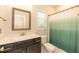 Clean bathroom with tub shower combo and dark vanity at 159 Shady Oaks Dr, Benson, NC 27504