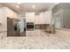 Modern kitchen with white cabinets, granite countertops and stainless steel appliances at 159 Shady Oaks Dr, Benson, NC 27504