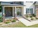 Front entrance with stone columns and a glass door at 159 Shady Oaks Dr, Benson, NC 27504