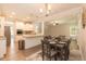 Dining room with hardwood floors, chandelier and a view to the kitchen at 159 Shady Oaks Dr, Benson, NC 27504