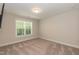 Bright bedroom with large window and neutral walls at 159 Shady Oaks Dr, Benson, NC 27504