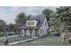 Modern farmhouse exterior with metal roof and covered porch at 109 Jones Ave, Hillsborough, NC 27278