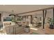Open concept living room with fireplace and kitchen views at 109 Jones Ave, Hillsborough, NC 27278