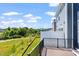 Deck overlooking a tree-lined landscape and distant mountains at 1113 Blackthorn Ln, Durham, NC 27703