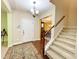 Bright entryway with hardwood floors, staircase, and access to the living areas at 6424 Sunset Manor Dr, Wake Forest, NC 27587