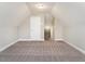 Spacious bonus room with neutral carpeting and ample storage at 2074 Burch Bridge Rd, Burlington, NC 27217