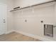 Laundry room with built-in shelving and hook for hanging clothes at 2074 Burch Bridge Rd, Burlington, NC 27217