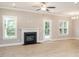 Spacious living room featuring a fireplace, hardwood floors, and access to the backyard at 2074 Burch Bridge Rd, Burlington, NC 27217