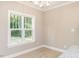 Bright dining room with large window and hardwood floors at 2074 Burch Bridge Rd, Burlington, NC 27217