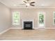 Bright living room with hardwood floors and a fireplace at 2074 Burch Bridge Rd, Burlington, NC 27217