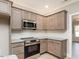 Kitchen with stainless steel appliances and light wood cabinets at 2074 Burch Bridge Rd, Burlington, NC 27217