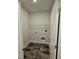 Laundry room with washer/dryer hookups and overhead shelving at 28 Decatur Dr, Fuquay Varina, NC 27526