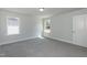 Bright bedroom with large windows, carpeted floors, and ample space at 42 Decatur Dr, Fuquay Varina, NC 27526