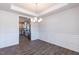 Dining room with coffered ceiling and view to the kitchen at 56 Decatur Dr, Fuquay Varina, NC 27526