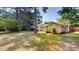 Tan house with large backyard and trees at 5141 Nc 56, Franklinton, NC 27525