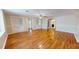 Spacious living room with hardwood floors and built-in shelving at 5141 Nc 56, Franklinton, NC 27525