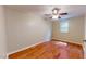 Bright bedroom with hardwood floors and ceiling fan at 5141 Nc 56, Franklinton, NC 27525