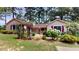 Ranch style home with mature landscaping and a spacious yard at 5141 Nc 56, Franklinton, NC 27525