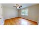Well-lit bedroom with hardwood floors and ceiling fan at 5141 Nc 56, Franklinton, NC 27525