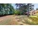 Wooded backyard with a large open area at 5141 Nc 56, Franklinton, NC 27525