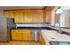 Farmhouse sink and updated cabinetry in kitchen at 5141 Nc 56, Franklinton, NC 27525