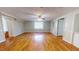 Bright living room with hardwood floors and ceiling fan at 5141 Nc 56, Franklinton, NC 27525