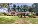 Charming ranch home with lush landscaping and a serene setting at 5141 Nc 56, Franklinton, NC 27525