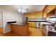 Kitchen with wood cabinets, granite countertops and island at 5141 Nc 56, Franklinton, NC 27525