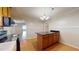 Kitchen island with granite countertop and wooden cabinets at 5141 Nc 56, Franklinton, NC 27525
