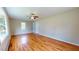 Hardwood floor bedroom with neutral walls and a ceiling fan at 5141 Nc 56, Franklinton, NC 27525