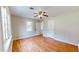 Spacious bedroom featuring hardwood floors and a ceiling fan at 5141 Nc 56, Franklinton, NC 27525