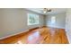 Bedroom with hardwood floors, bay window, and ceiling fan at 5141 Nc 56, Franklinton, NC 27525