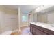 Updated bathroom with double vanity and shower at 5141 Nc 56, Franklinton, NC 27525