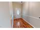 Front entry with hardwood floors and glass-paned door at 5141 Nc 56, Franklinton, NC 27525