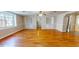 Living room with hardwood floors and built-in shelving at 5141 Nc 56, Franklinton, NC 27525