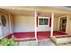 Front porch with red floor and access to two doors at 5141 Nc 56, Franklinton, NC 27525