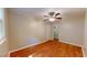 Bedroom with hardwood floors, ceiling fan, and access to closet at 5141 Nc 56, Franklinton, NC 27525