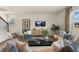 Bright and airy living room with hardwood floors and ample seating at 6421 Alfalfa Ln, Wake Forest, NC 27587