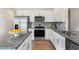Modern kitchen with stainless steel appliances and granite countertops at 6421 Alfalfa Ln, Wake Forest, NC 27587