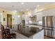 Modern kitchen with white cabinets, granite countertops, and island at 409 Swift Creek Xing, Durham, NC 27713