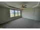 Spacious bedroom with ceiling fan and large windows at 80 Lotus Ave, Smithfield, NC 27577