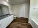 Bathroom with a toilet, vanity, shower, and garden tub at 80 Lotus Ave, Smithfield, NC 27577